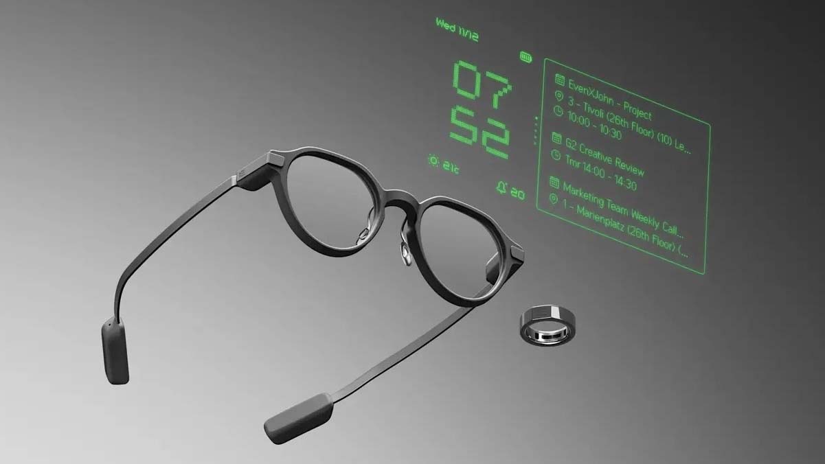 Person mit Even G2 Smart Glasses im Gespräch, im Hintergrund unscharf ein Meetingraum, Brille wirkt wie gewöhnliche Alltagsbrille